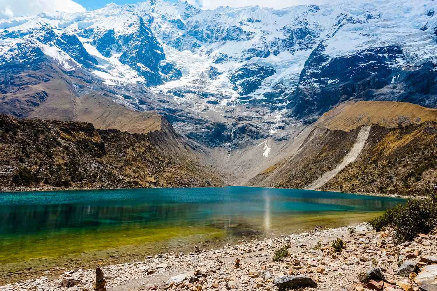 laguna-humantay-with-snow-and-beautiful-pastures-cusco-peru-1500x1000